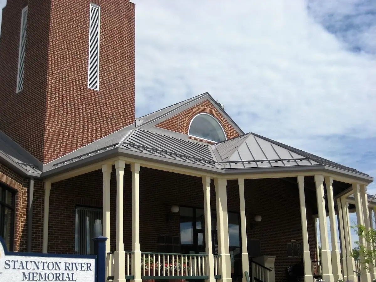 Skilled roofing craftsmen working on a residential roof in Smithville